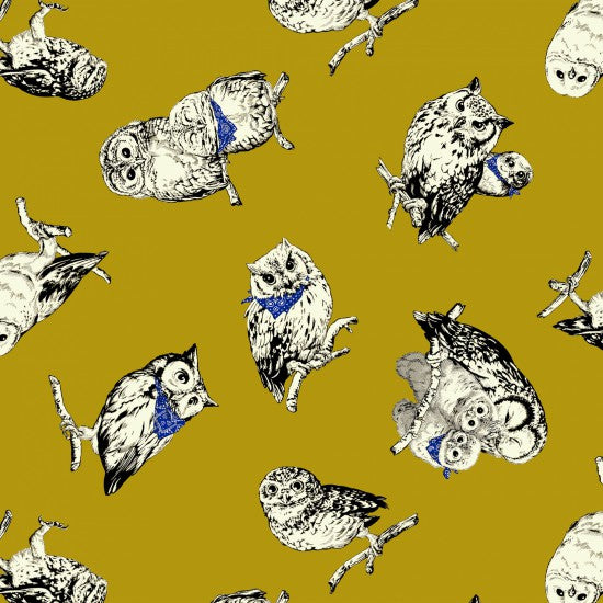 A fabric with a mustard yellow background featuring a repeated design of black and white owls in various poses.
