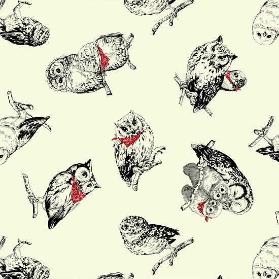 A fabric with a natural background featuring various designs of owls in black and white with some elements in red.