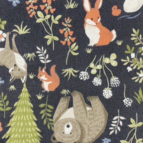 Navy background Quilting fabric with a playful animal design featuring bears, squirrels, bunnies, horses, owls, ducks, and foxes among flowers and trees.