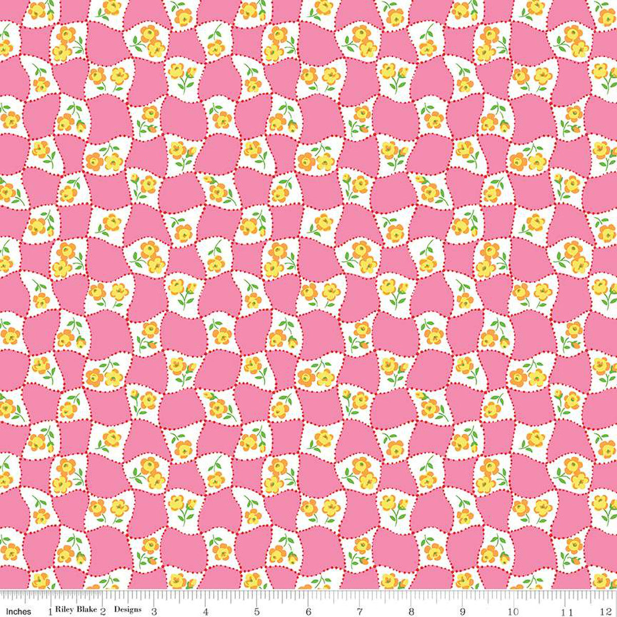 A Quilt fabric from Liberty of London, featuring a pink background with yellow floral posy designs.