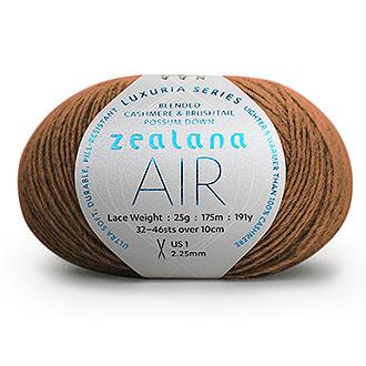 Ball of camel brown yarn with a 'Zealana Air Lace' label on a white background