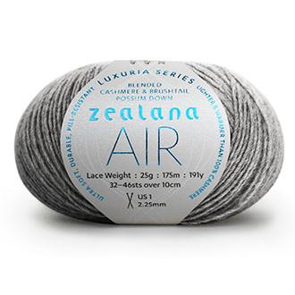 Ball of medium grey yarn with a 'Zealana Air Lace' label on a white background