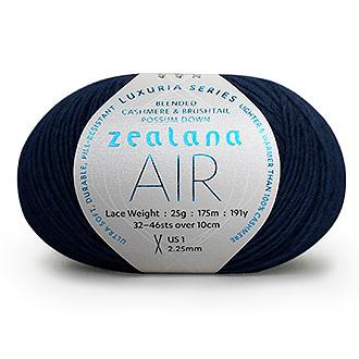 Ball of dark navy blue yarn with a 'Zealana Air Lace' label on a white background