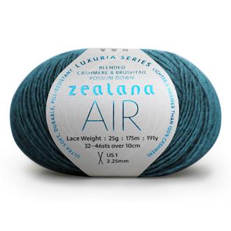 Ball of bright peacock blue yarn with a 'Zealana Air Lace' label on a white background