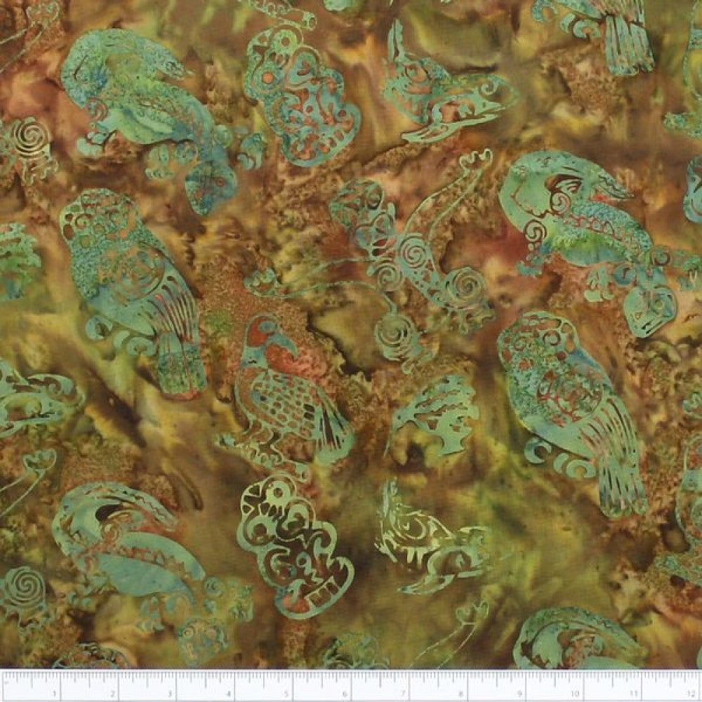 New Zealand designed quilt fabric with Maori icons on a textured background in shades of green and brown