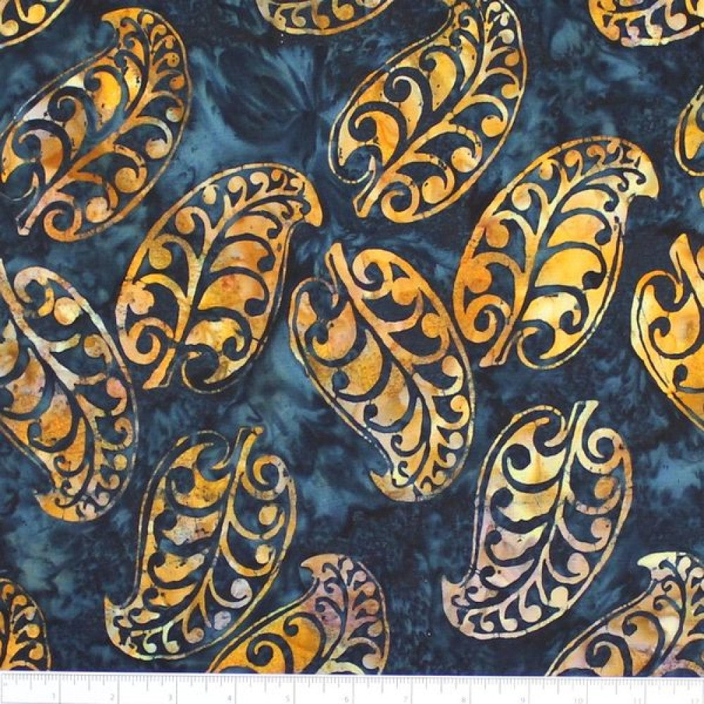 New Zealand designed quilt fabric with Maori style leaf design in rusty orange on navy blue
