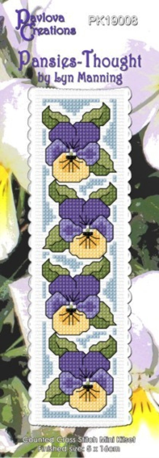 Cross-stitch kit for 'Pansies' by Lyn Manning with yellow and purple flowers on a white background.