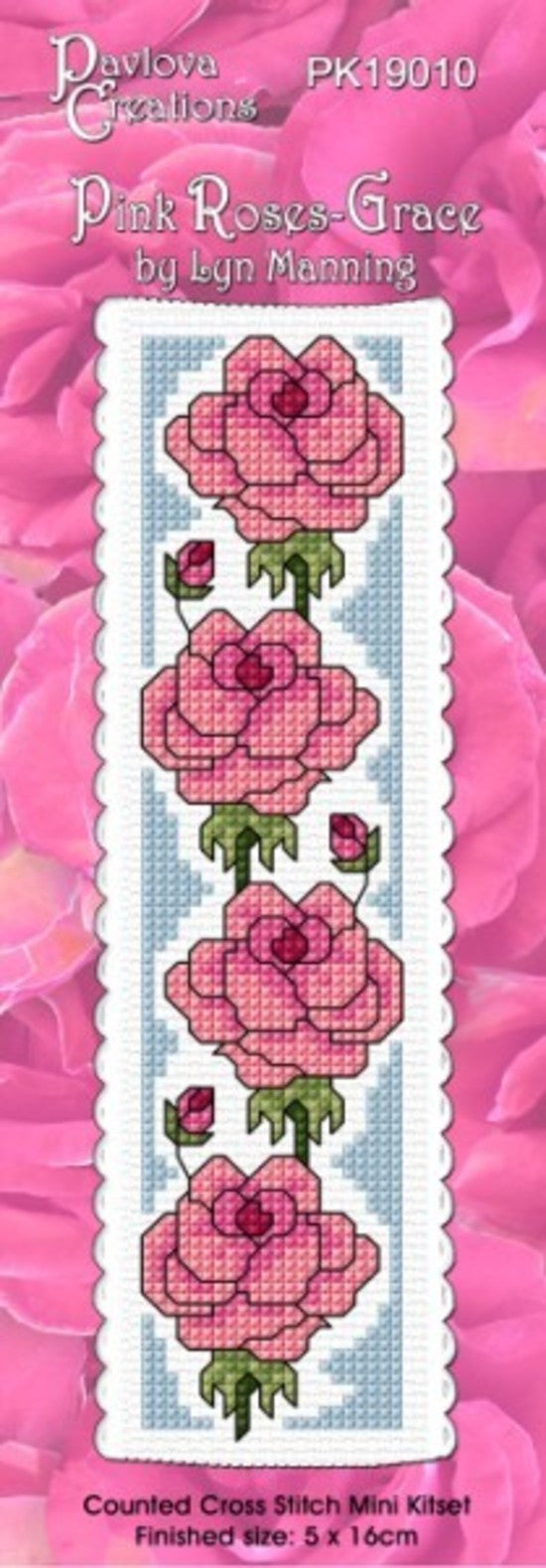 Cross-stitch kit for 'Pink Roses' by Lyn Manning with pink and green flowers on a white background.