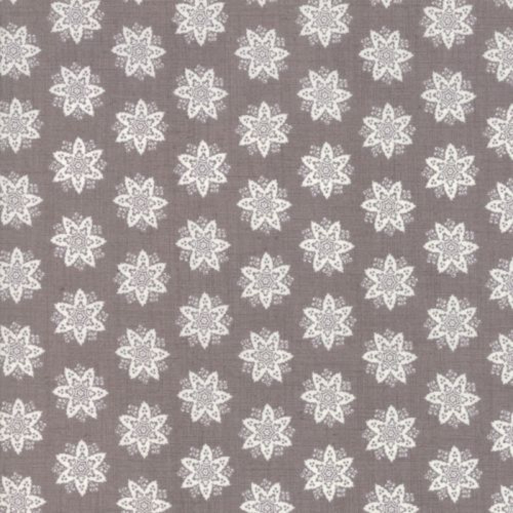 Quilting Fabric with a floral star design in gray and white colors