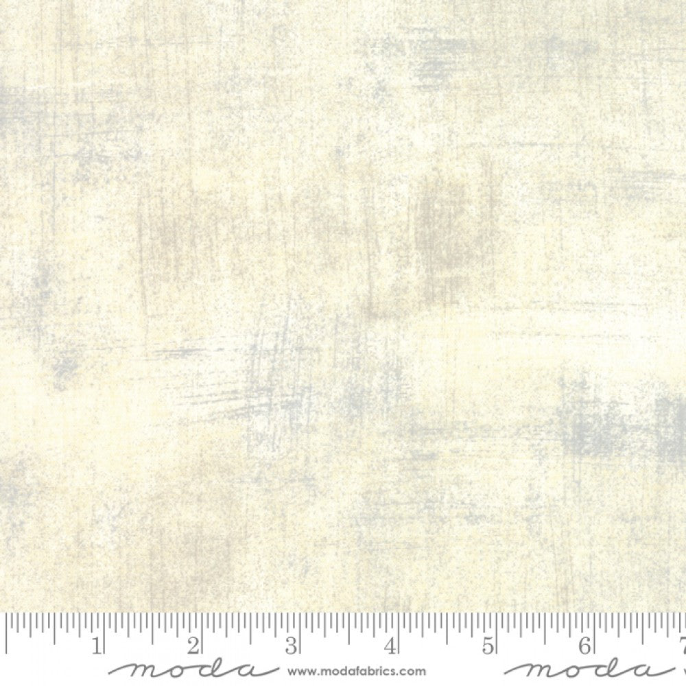 A swatch of quilting fabric showing an off-white textured-effect.