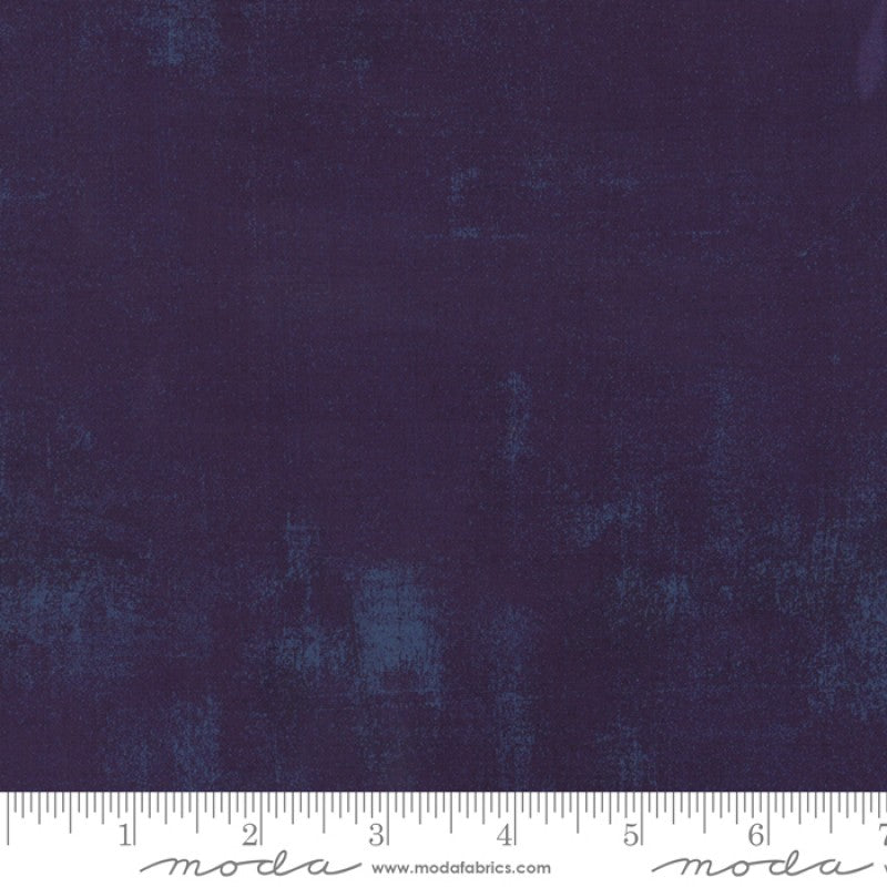 A swatch of textured purple quilt fabric swatch.