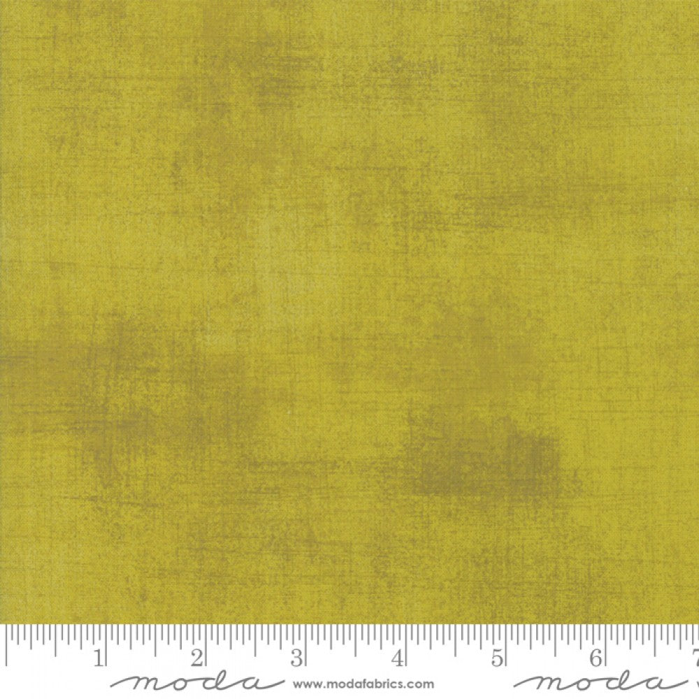A swatch of yellow textured cotton quilting fabric.