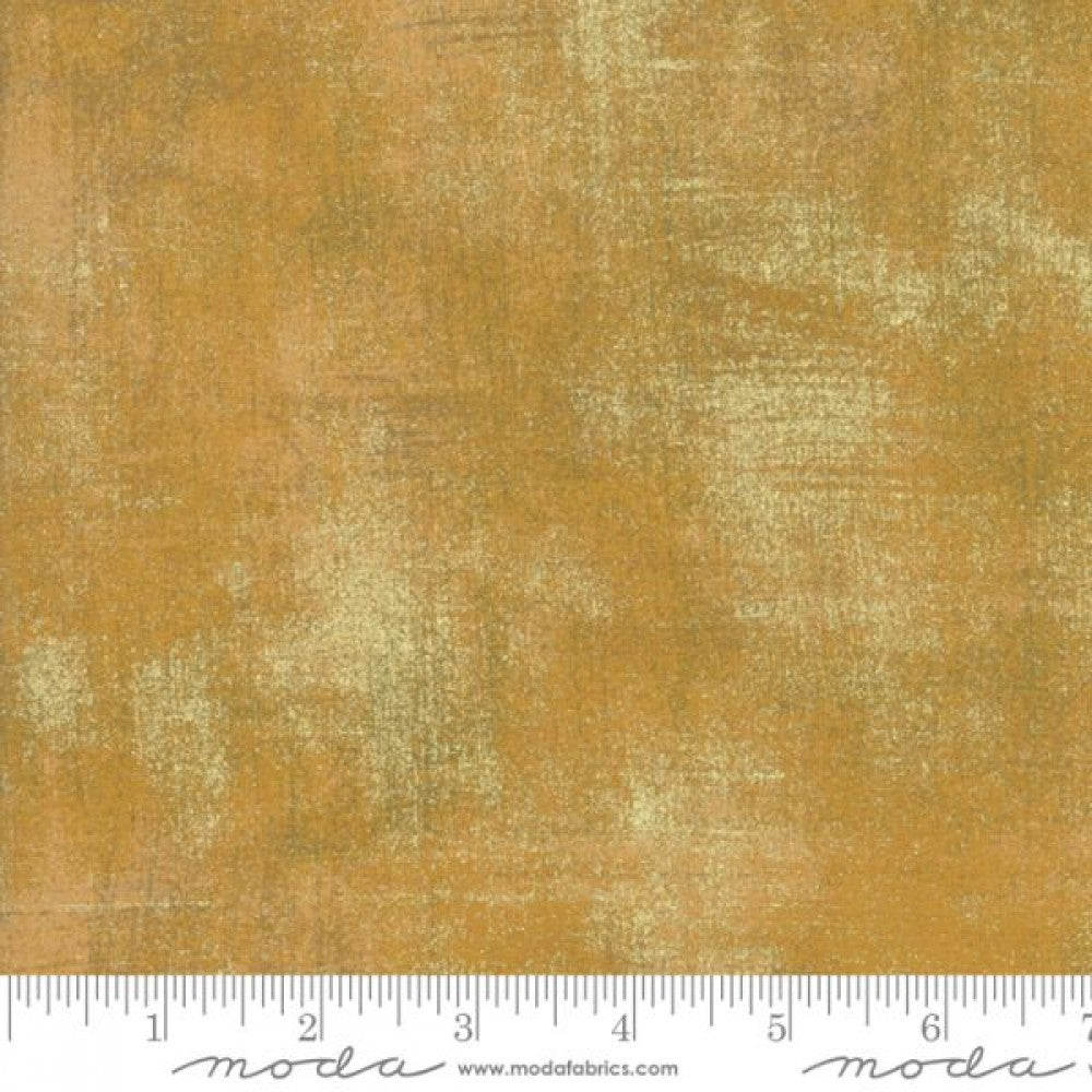 A swatch of metallic harvest gold fabric with a textured effect.