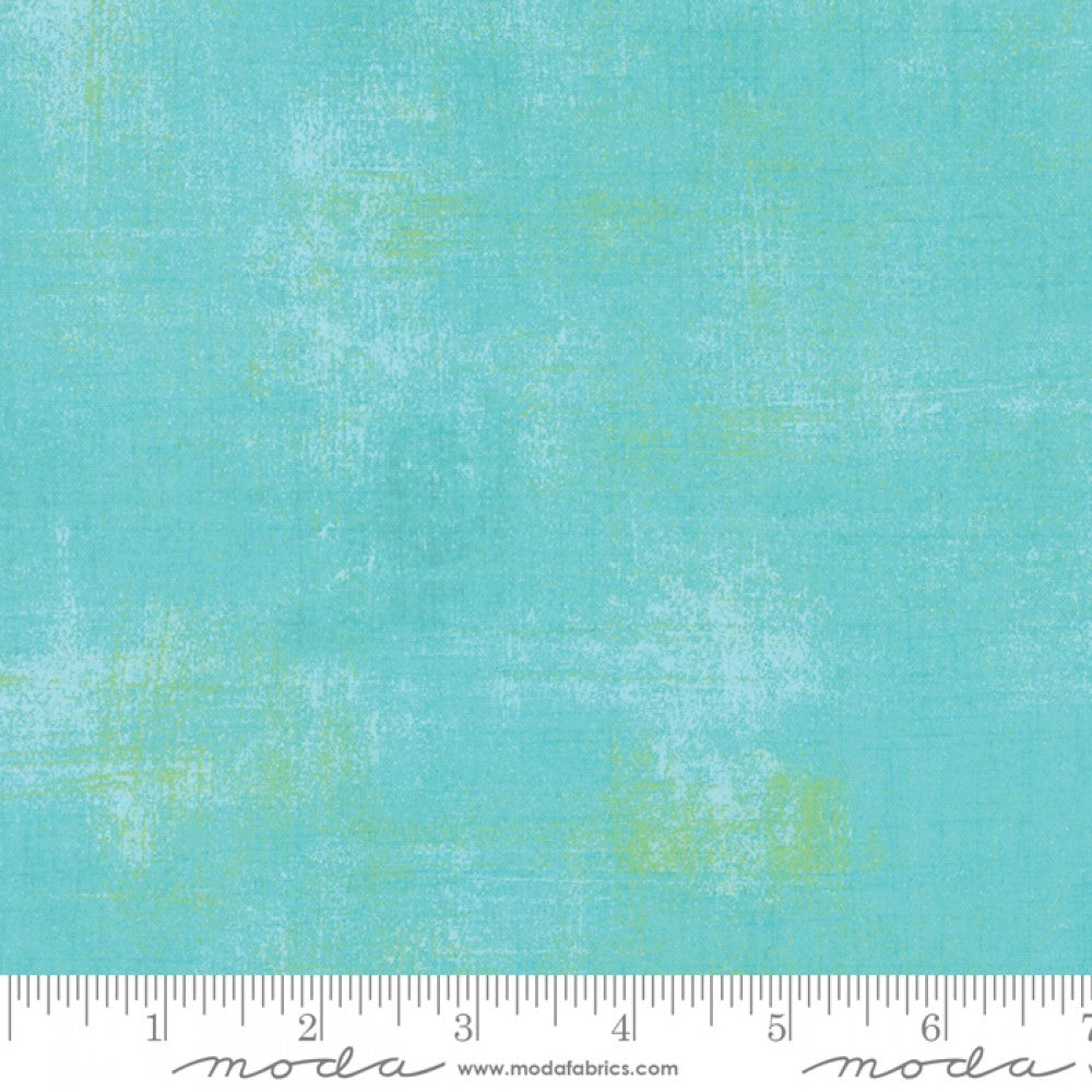 A swatch of textured-effect blender fabric in a pool blue cloth.
