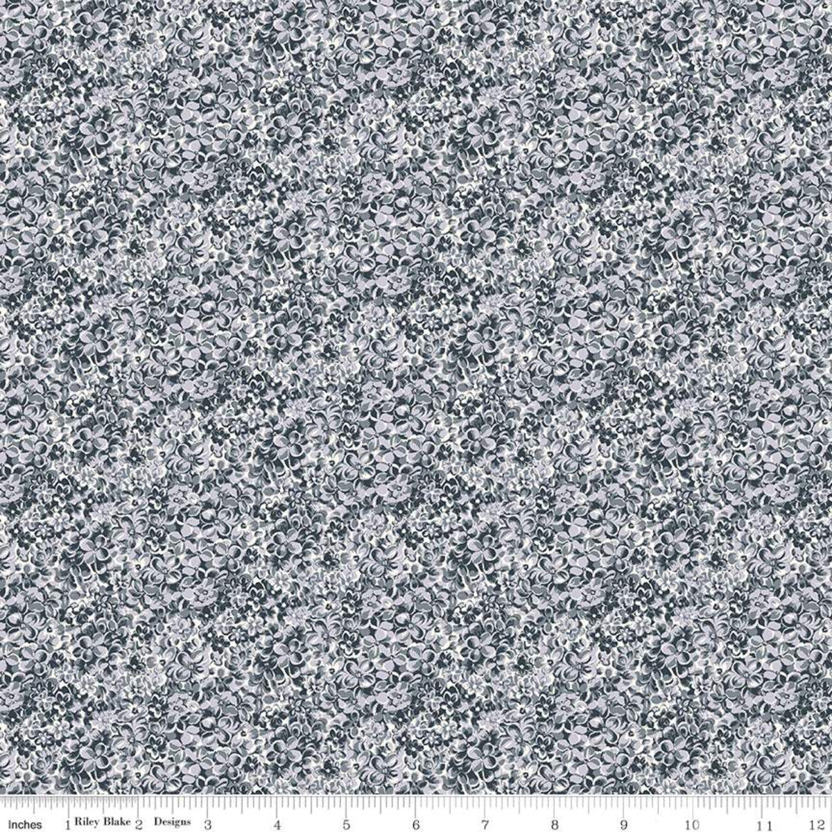 Quilting fabric from the Liberty of London Emporium Collection featuring a floral design in shades of grey and white.