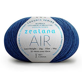 Ball of bright cobalt blue yarn with a 'Zealana Air Lace' label on a white background