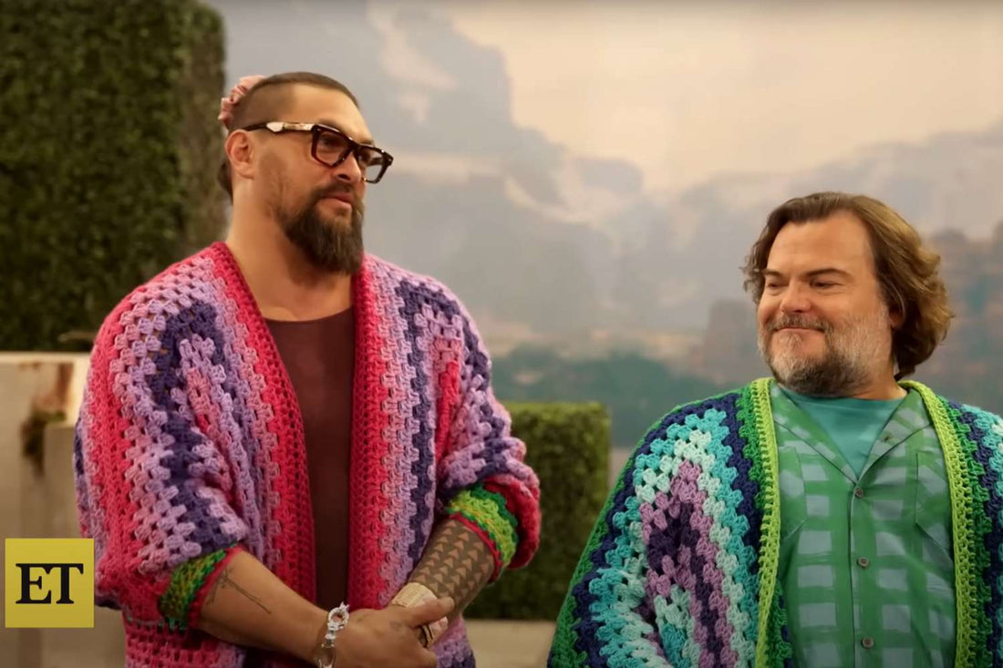 Humorous picture of Jason Momoa and Jack Black wearing crochet sweaters