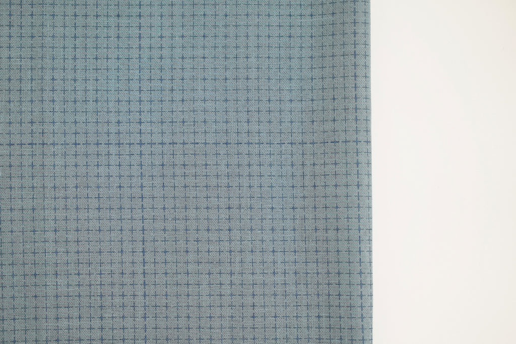 Medium blue fabric with a pre-printed grid for Sashiko embroidery.
