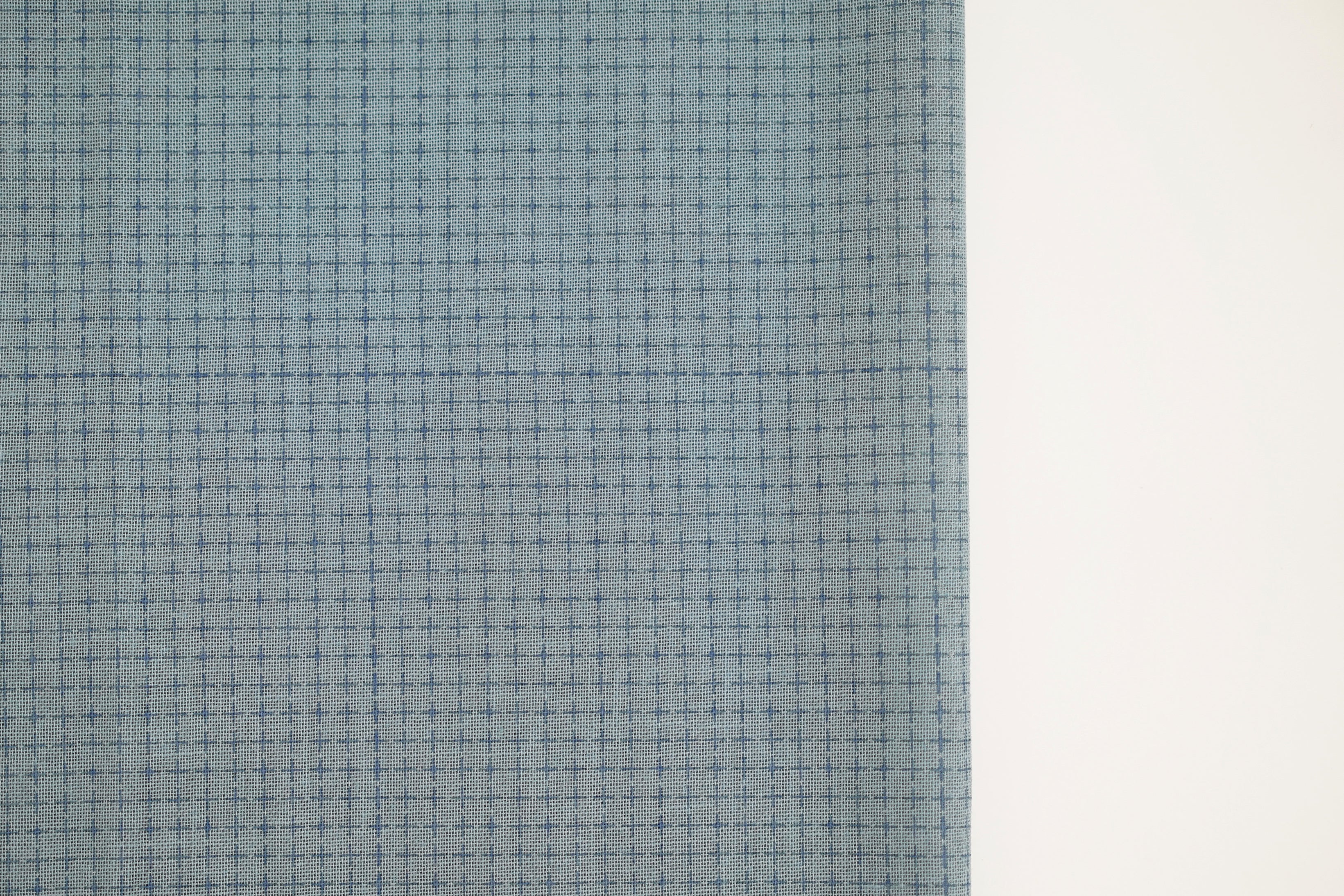 Medium blue fabric with a pre-printed grid for Sashiko embroidery.