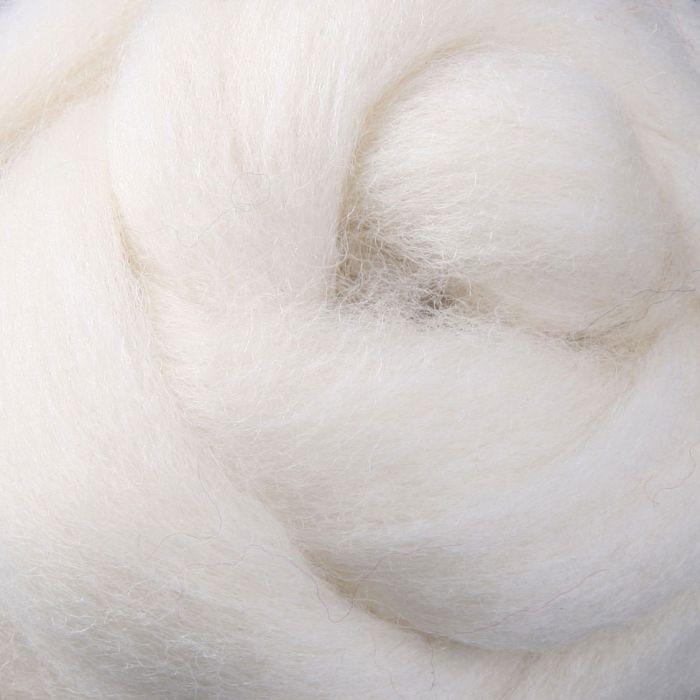 Close-up sample of white unspun fibre for use in spinning or felting