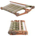 Wooden weaving loom with striped fabric on a white background
