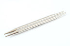 Pair of silver knitting needles on a white background