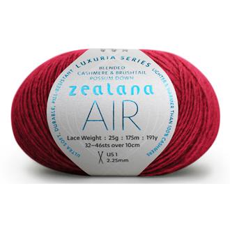 Ball of bright red yarn with a 'Zealana Air Lace' label on a white background