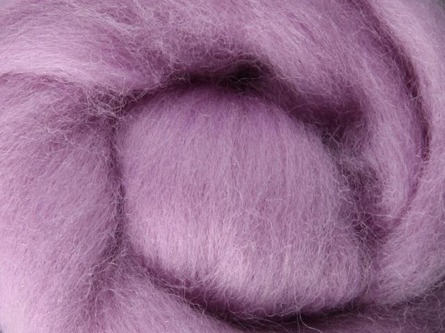 Closeup of New Zealand unspun fibre in colour Lavender