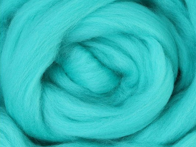 Closeup of New Zealand unspun fibre in colour Aqua