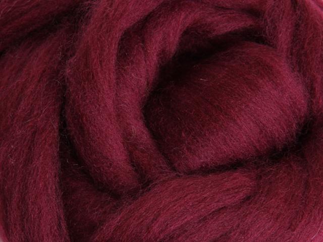 Closeup of New Zealand unspun fibre in colour Aubergine