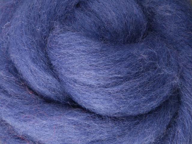 Closeup of New Zealand unspun fibre in colour Blueberry