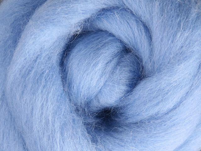 Closeup of New Zealand unspun fibre in colour Bubblegum
