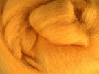 Closeup of New Zealand unspun fibre in colour Butterscotch