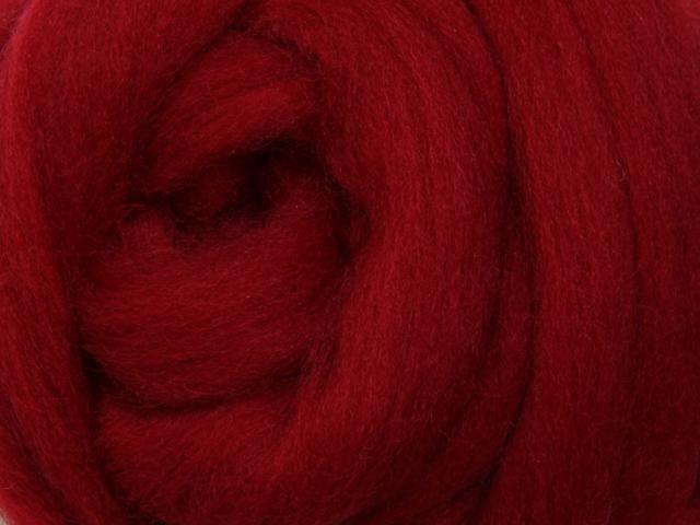 Closeup of New Zealand unspun fibre in colour Cherry Red