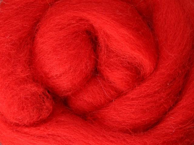 Closeup of New Zealand unspun fibre in colour Chilli Pepper