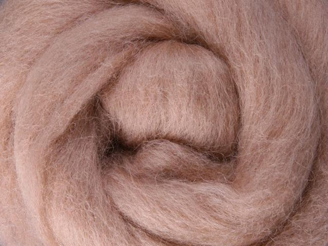 Closeup of New Zealand unspun fibre in colour Cookie