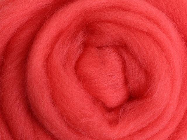 Closeup of New Zealand unspun fibre in colour Coral