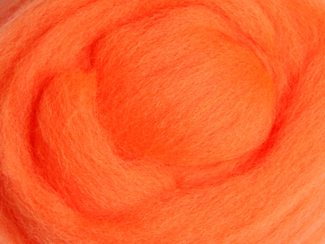 Closeup of New Zealand unspun fibre in colour Fluro Orange