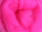 Closeup of New Zealand unspun fibre in colour Fluro Pink