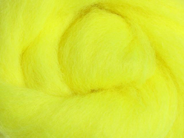Closeup of New Zealand unspun fibre in colour Fluro Yellow