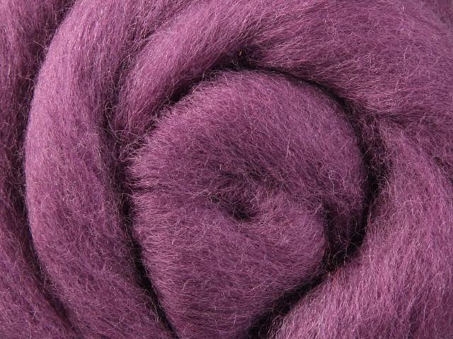 Closeup of New Zealand unspun fibre in colour Grape Jelly