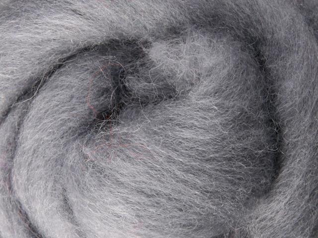 Closeup of New Zealand unspun fibre in colour Grey