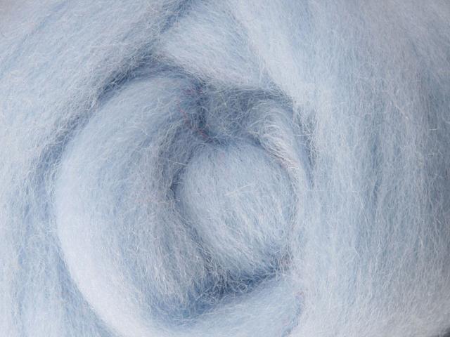 Closeup of New Zealand unspun fibre in colour Ice