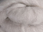 Closeup of New Zealand unspun fibre in colour Natural Light Undyed