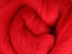 Closeup of New Zealand unspun fibre in colour Scarlet