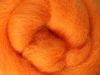Closeup of New Zealand unspun fibre in colour Tangerine