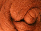 Closeup of New Zealand unspun fibre in colour Toffee