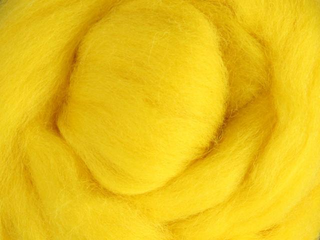 Closeup of New Zealand unspun fibre in colour Yellow