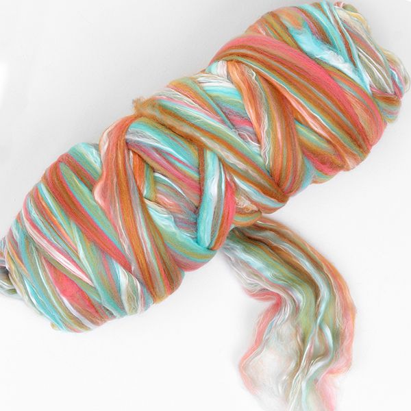 Picture of a batt of New Zealand Merino and Silk unspun fibre dyed in multi-colours of the arizona desert rusts and turquoise