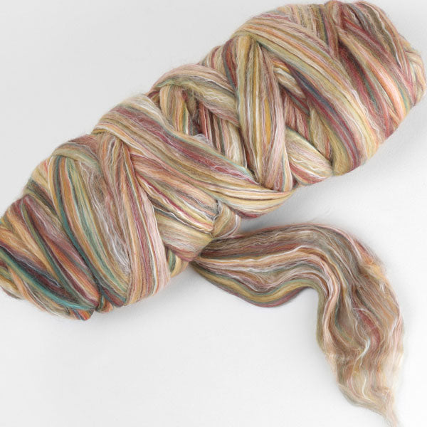 Picture of a batt of New Zealand Merino and Silk unspun fibre dyed in multi-colour cinnamon beiges and browns